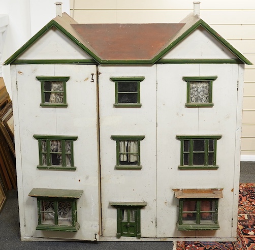 A large early 20th century double fronted wooden doll’s house, with two opening sections at the front and six internal rooms and stairwell, 120cm high, 112cm wide, 42cm deep. Condition - poor to fair